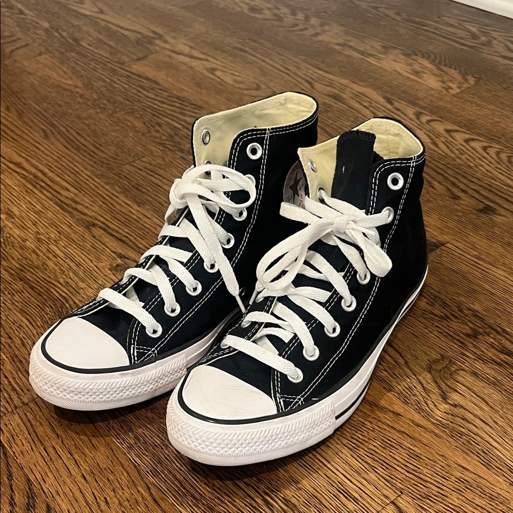 Converse Black and White High-Top Sneakers. Women’s size 10. Men’s size 8.